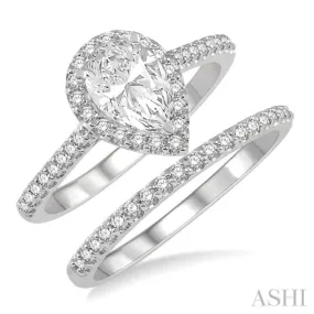 1 1/4 ctw Round Cut Diamond Wedding Set With 1 1/10 ctw Pear Cut 3/4 ctw Center Stone Engagement Ring and 1/5 ctw Wedding Band in 14K White Gold